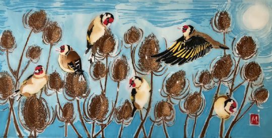 Goldfinches on Teasels in Winter Sun