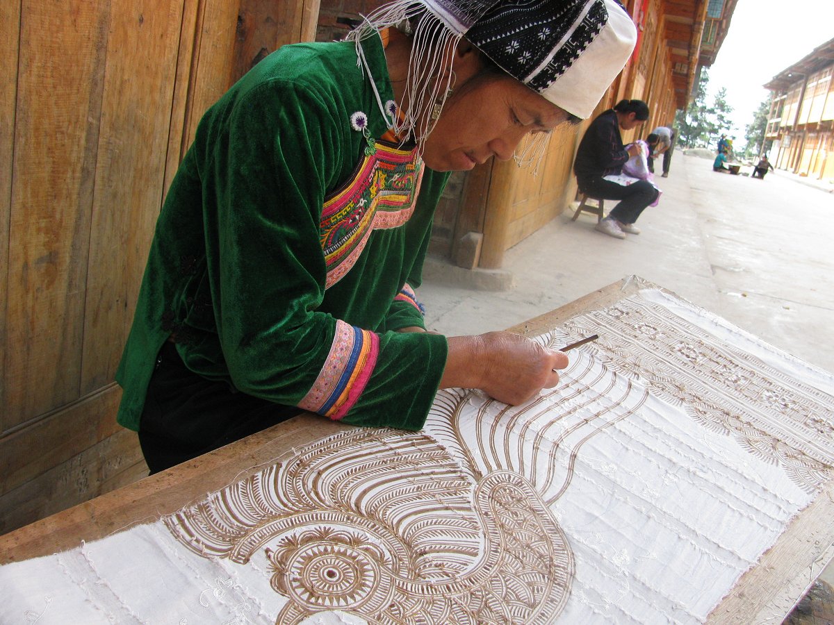 Waxing a banner in Wuji village. Guizhou, South-west China